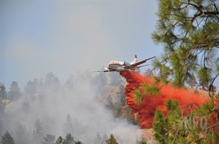 An air tanker drops retardant on a fire in West Kelowna Tuesday afternoon.