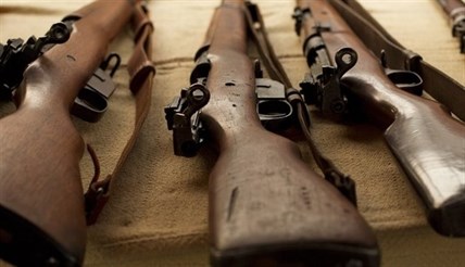 Canadian-made, WWI-era Ross rifles, owned by collector Bob McCormick, are shown at his home in Haldimand, Ont., on Thursday, August 7, 2014.