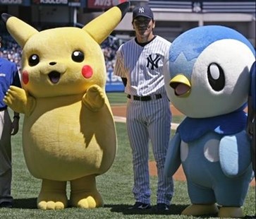 Yankees' Hideki Matsui, center, poses with Pokemon characters Pikachu, left, and Piplup.
