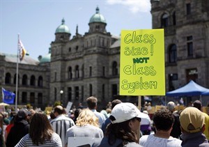 B.C. teachers, parents and other union supporters rally on the lawn of the Legislature on June 16, 2014 in Victoria. 