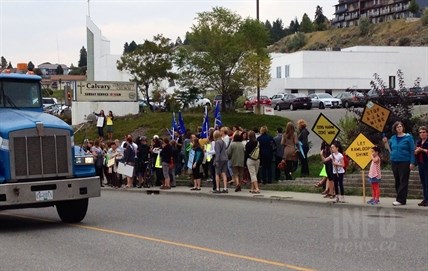 More than 200 people gathered along Rogers Way to wait for Premier Christy Clark and cabinet members to arrive, Sept. 17, 2014.