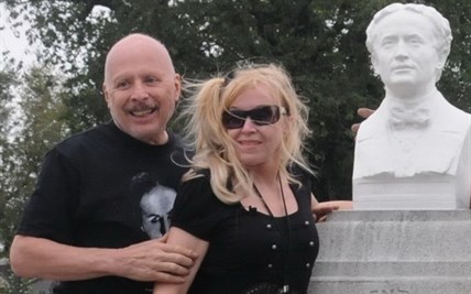 Dorothy Dietrich, right, and Dick Brookz pictured in front of the restored bust on the granite monument at Houdini's grave.