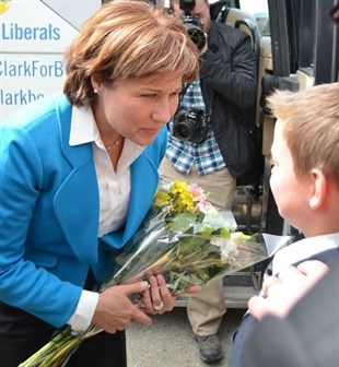 Isaac White, 11, says he was excited to give a bouquet of flowers to Christy Clark, even though he's not that familiar with her campaign. 