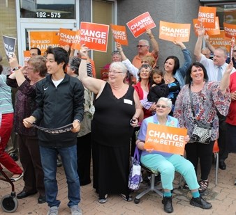 Eager NDP fans wave to NDP leader Adrian Dix as he walked towards the party's Penticton campaign office Monday evening.