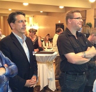8:50 pm Lib candidate Dan Ashton and supporter Andrew Jakubeit watch early results at Ramada Inn. 