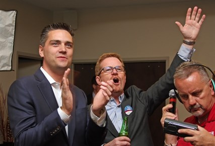 Kamloops Liberal candidates Todd Stone and Terry Lake celebrate as another Liberal candidate takes a seat elsewhere in the province.