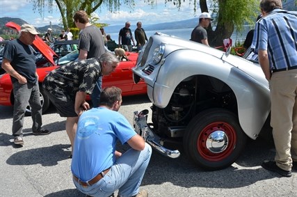 Propped hoods allowed car enthusiasts to get a close look at different engines.
