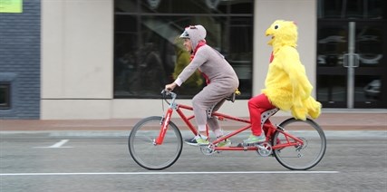 Penticton acting mayor Garry Litke and city manager Annette Antoniak dressed up as a chicken and deer to ride in front of city hall on Wednesday. This was the price for losing a bet with the Regional District Okanagan Similkameen in a Bike to Work Week contest.