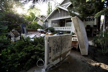 The clean-up begins for Calgary homeowners allowed back into their neighbourhoods.
