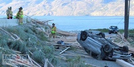 The driver and passenger of this car were taken to Penticton Regional Hospital with minor injuries. The flipped car was at the same site where a transport truck carrying lumber flipped and crashed late Monday afternoon on Highway 97. The crash site was several kilometres north of Summerland and northbound traffic was delayed for 30-minutes plus.
