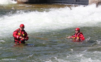 Two Penticton firefighters practice swiftwater rescue training on Thursday at the mouth of the Okanagan River channel.