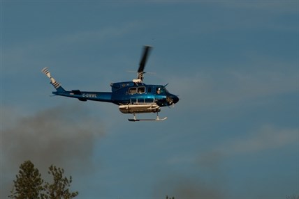 Helicopters and planes were called in to fight a fire near Kelowna Airport on Thursday afternoon.