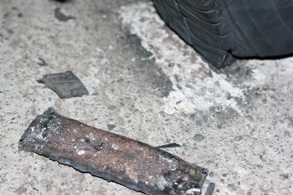 A piece of metal sent flying by the explosion punched through a neighbour's garage and landed on the concrete floor.