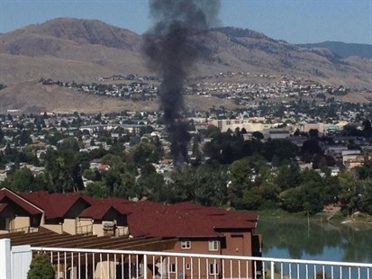 Black smoke can be seen from quite a distance as a fire rages in a North Shore home.