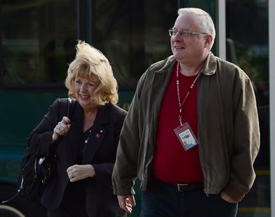Senator Pamela Wallin with assistant Mark Fisher arrive at the Senate on Tuesday, Oct. 22, 2013.