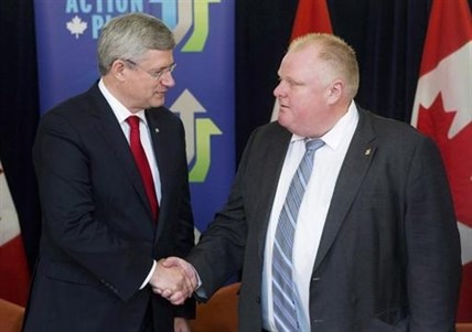 Prime Minister Stephen Harper shakes hands with Toronto Mayor Rob Ford on September 22, 2013.