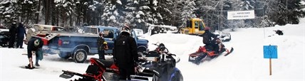 Members of the Hunters Range Snowmobile Association gather at one of the club's trail heads.