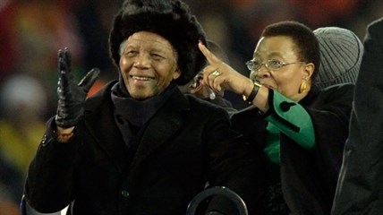 Former South African President Nelson Mandela, left, with his wife Graca Machel, right, attends the final of the FIFA World Cup Soccer Tournament in Johannesburg in this file photo taken July 11, 2010 -- Mandela's last public appearance.