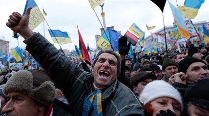 Pro-European Union activists shout slogans during a rally in the Independence Square in KIev, Ukraine, Sunday, Dec. 8, 2013.
