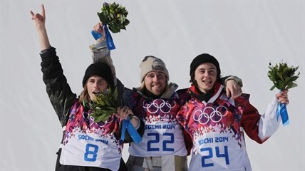 United States' Sage Kotsenburg, centre, celebrates with Norway's Staale Sandbech, left, and Canada's Mark McMorris after Kotsenburg won the men's snowboard slopestyle final at the Rosa Khutor Extreme Park, at the 2014 Winter Olympics in Krasnaya Polyana, Russia, Saturday, Feb. 8, 2014.