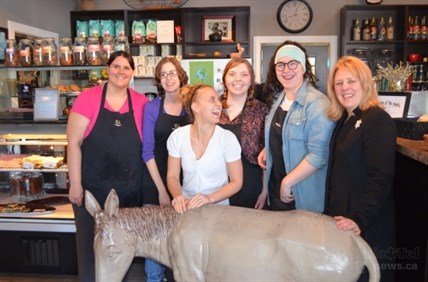 Ann Stanyer, Cat Chalk, Jen Thompson, Christine Kirby, Bailey Guenther and Carole Macbain of the Talkin' Donkey with the coffee house's beloved mascot, whose spirit will live on. 