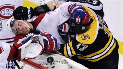 Boston Bruins left wing Milan Lucic, right, tangles with Montreal Canadiens right wing Brendan Gallagher (11) during the third period of Game 2 in the second-round of the Stanley Cup hockey playoff series in Boston, Saturday, May 3, 2014. The Bruins defeated the Canadiens 5-3, tying the best-of-seven games series at one game each.