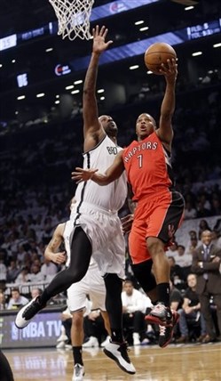 Toronto Raptors' Kyle Lowry (7) drives past Brooklyn Nets' Andray Blatche during the first half of Game 6 of the opening-round NBA basketball playoff series Friday, May 2, 2014, in New York.