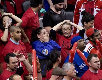 Toronto Raptors fans react in the final seconds of the second half of Game 7 of the opening-round NBA basketball playoff series against the Brooklyn Nets in Toronto, Sunday, May 4, 2014.