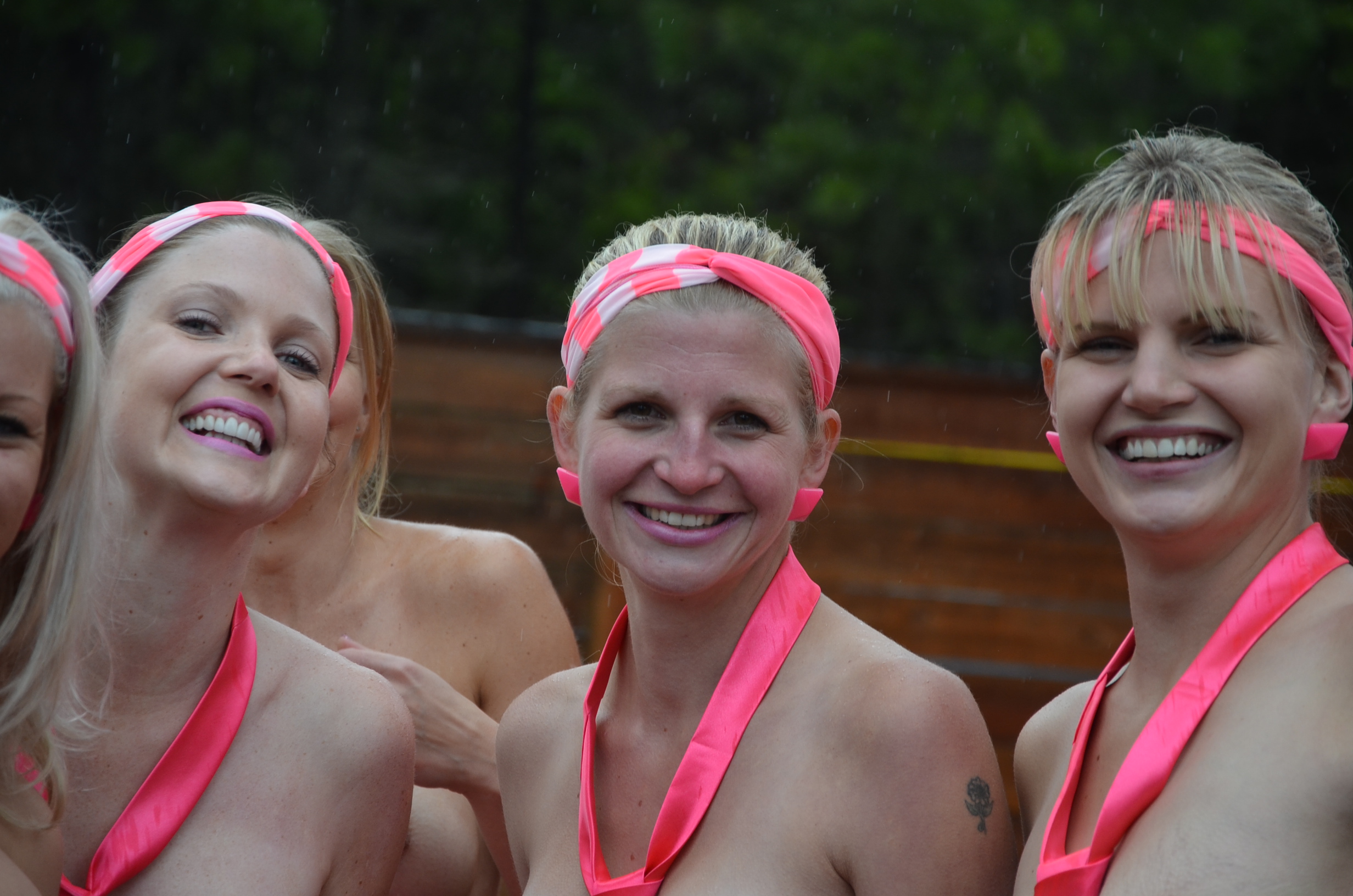 Naked zipliners brave rainy weather for breast can image