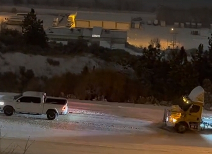 Pickup tows semi up slippery Kamloops road