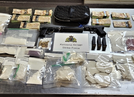 Kelowna RCMP raid on drug dealer’s home nets guns, drugs and cash