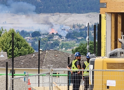 Penticton grass fire highly visible as crews work to put it out