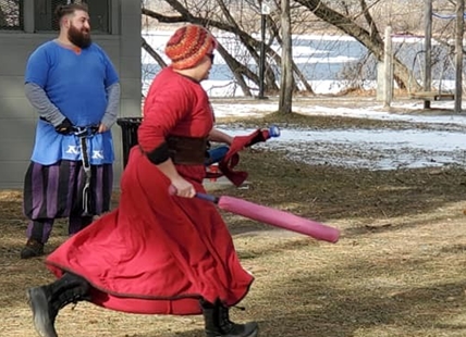 What grownups in costume are playing in a Kamloops park every week