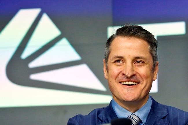 Brendan Kennedy, CEO and founder of British Columbia-based Tilray Inc., poses next to his company's logo at Nasdaq where the company's IPO (TLRY) opened, Thursday, July 19, 2018, in New York. THE CANADIAN PRESS/AP/Bebeto Matthews