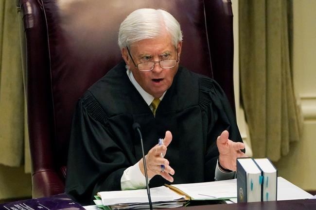 Mississippi Supreme Court Chief Justice Michael Randolph questions attorneys presenting arguments over a lawsuit that challenges the state's initiative process and seeks to overturn a medical marijuana initiative that voters approved in November 2020, Wednesday, April 14, 2021, in Jackson, Miss. (AP Photo/Rogelio V. Solis)