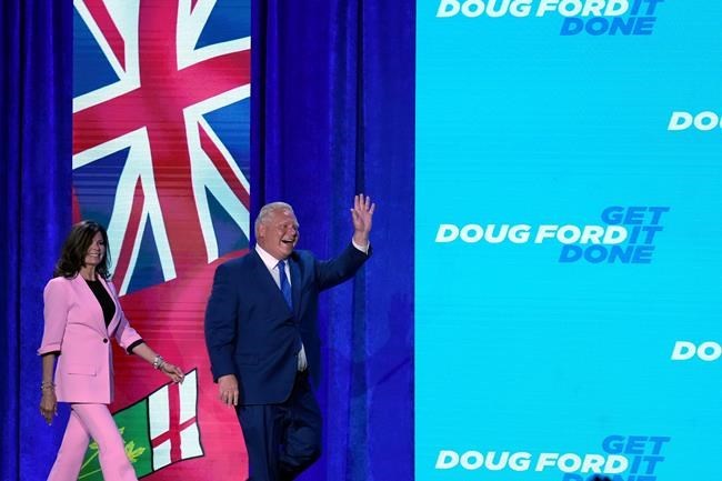 Ontario Premier Doug Ford and wife Karla embrace onstage after being re-elected in the Ontario provincial election, in Toronto, Thursday, June 2, 2022. THE CANADIAN PRESS/Nathan Denette