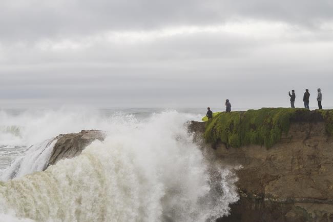 Huge surf pounds West Coast and Hawaii flooding some low lying