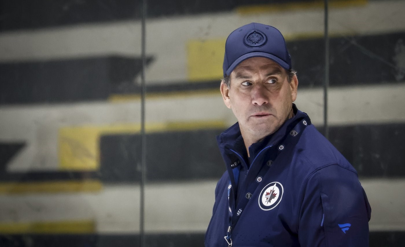 Jets' coach Arniel stickhandles around Hellebuyck's status