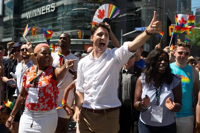 Crowds gather as massive Pride parade takes over downtown Toronto ...