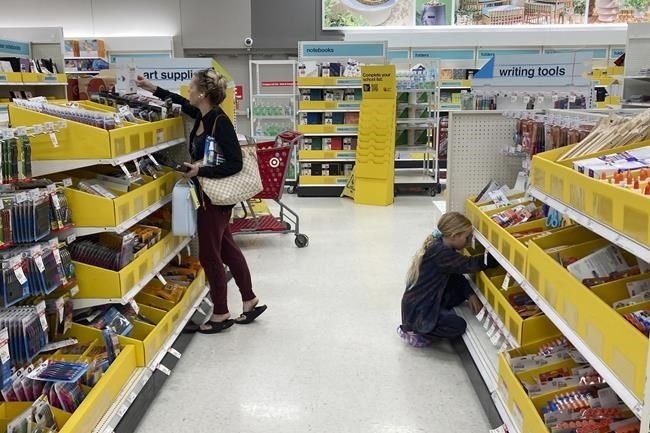The stationary aisles are expected to be busier this year as parents and students stock up on back-to-school essentials, though their baskets may be a little less full. A parent shops for school supplies deals at a Target store, Wednesday, July 27, 2022, in North Miami, Fla. 
