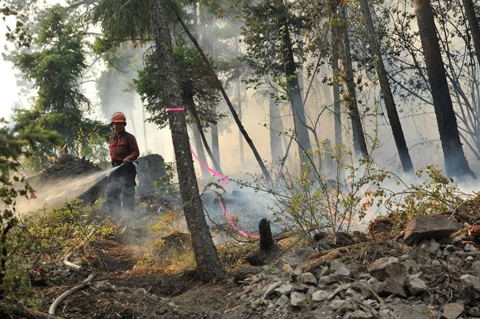 A crew member responding to the McDougall Creek wildfire. 