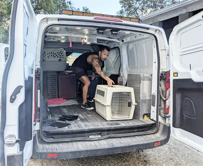 A worker loads supplies in a BC SPCA van bound for Vernon to help the animals in care as a result of the wildfire.