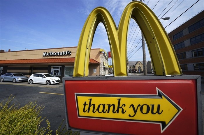 FILE - An exit sign is shown at a McDonald's restaurant in Pittsburgh, April 23, 2022. Food ads have long made their subjects look bigger, juicier and crispier than they are in person. But some consumers say those mouthwatering ads can cross the line into deception, and that’s leading to a growing number of lawsuits. Burger King is the latest company in the crosshairs. While the case against Burger King was filed in Miami, one of the attorneys who filed it has similar cases pending in New York against Wendy’s, McDonald’s and Taco Bell.