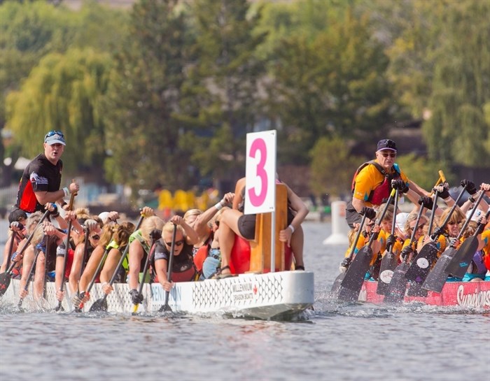Two boats race at the Dragon Boat Festival in Penticton in this undated photo. 