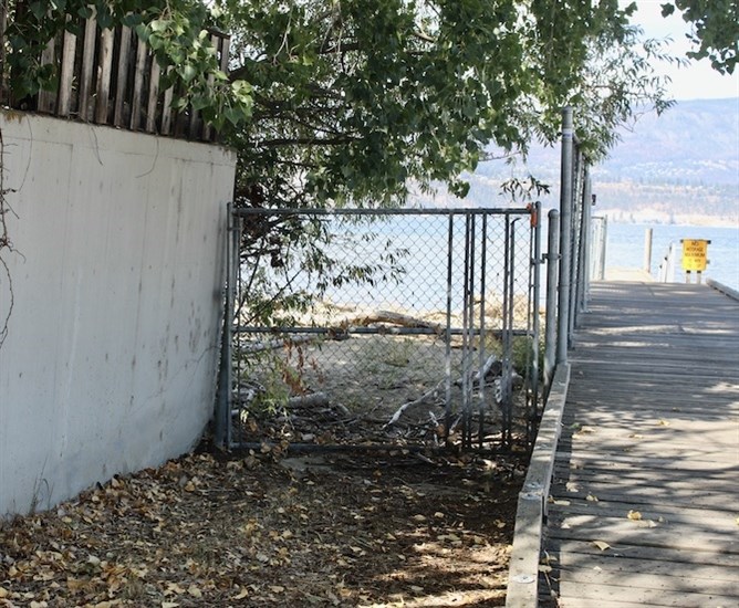 This is the  fence blocking access to the waterfront south of the Cook Road Boat Launch.