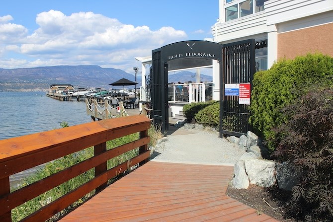 This is the gate at Hotel Eldorado that's now open during the day. The blue sign reads: Private Property: Daytime public access on the Hotel Eldorado and Manteo boardwalks is available by agreement between the Owners and the City of Kelowna.