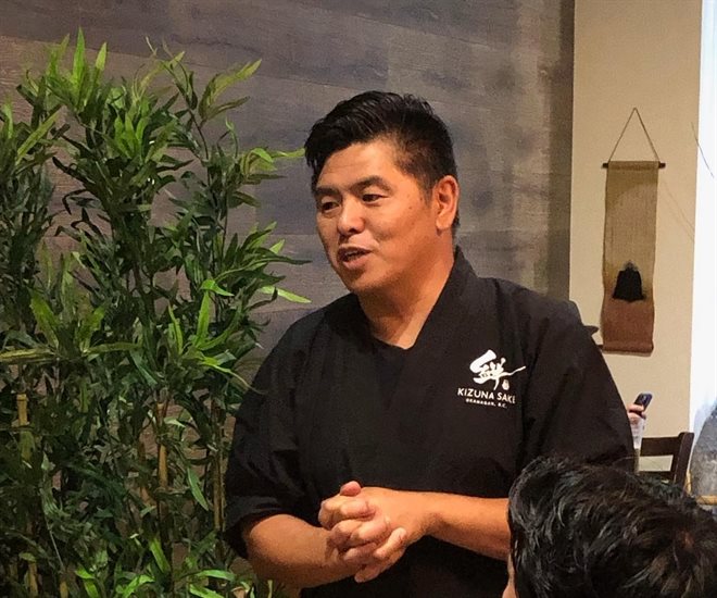 Penticton restaurant and sake brewery owner Tatsuo Kan talks about sake food pairing at a restaurant in Vanouver in September. 