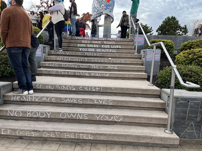 Stairs in Stuart Park decorated with chalk messages about protecting transgender youth.