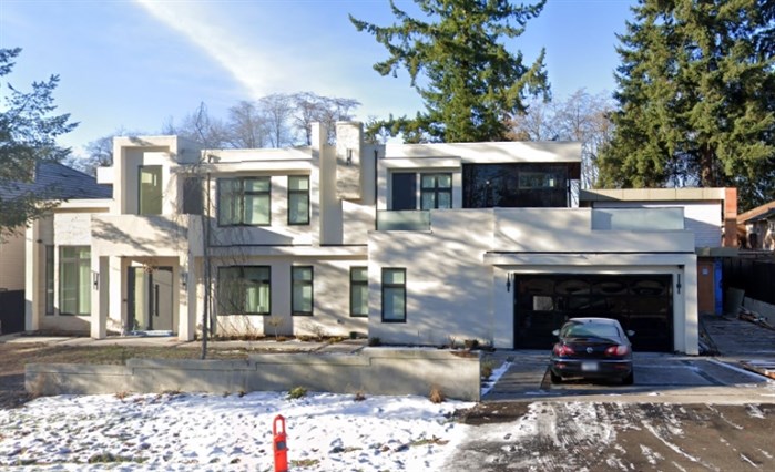 Extensions to this Surrey home, shown in a December 2021 Google Street View image, will have to be torn down after a realtor failed to get permits from the city.