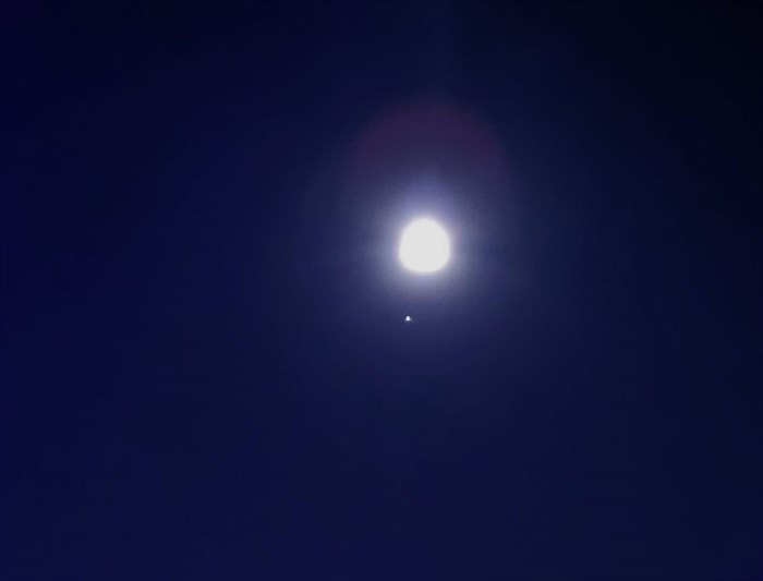 The full Hunter's Moon seen over Kamloops with the bright planet Jupiter. 